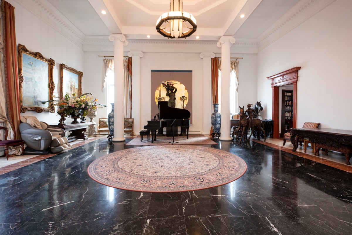 309 108th St E PH NEW YORK, New York Grand Hall/4 Bedrooms/ 2 full baths/2 half baths.Interior 4300+ sqft / Exterior 1700+ sqft = Total 6,000+sqft Low CC and Taxes: $1,100/ and $21,337 per year.A keyed elevator landing opens into a stunning grand hall with 20 ceilings and an elegant custom made set in lights over sweeping columns. This is a one of a kind crown jewel of an expanse and is rarely seen; a very special place for entertaining. On the east side of the grand and gracious hall is an elegant living room with a wood-burning fireplace, Moor style open ceiling and glass doors leading to a sun drenched south-facing greenhouse.The eastern end of the greenhouse invites you to unwind with open views and is an exceptional outdoor space. Adjacent to the living room is an impressive and imposing formal dining room with open high ceilings. The kitchen is fully equipped with a large center island and this is a glorious and sunny space and a wrap around terrace.The first floor level is also comprised of a guest room with wood burning fireplace, full bath, powder room, laundry room, coat closet, and back stairs. The spacious upstairs has an enormous hallway overlooking the gracious dining room and has access to an exotic greenhouse. Inside of this Moorish influenced beauty, are beautifully designed railings and the hallways leads to a master bedroom suite with ample closet space. Adjoining the master bedroom is a second bedroom/study with a half bath. Each floor is zoned separately for gas heating and has a commercial cooling unit in addition to solar panels. There are 2 full baths and 2 half baths. This property has plenty of character and exquisite details that makes this unit a truly unique home. Some improvements needed.